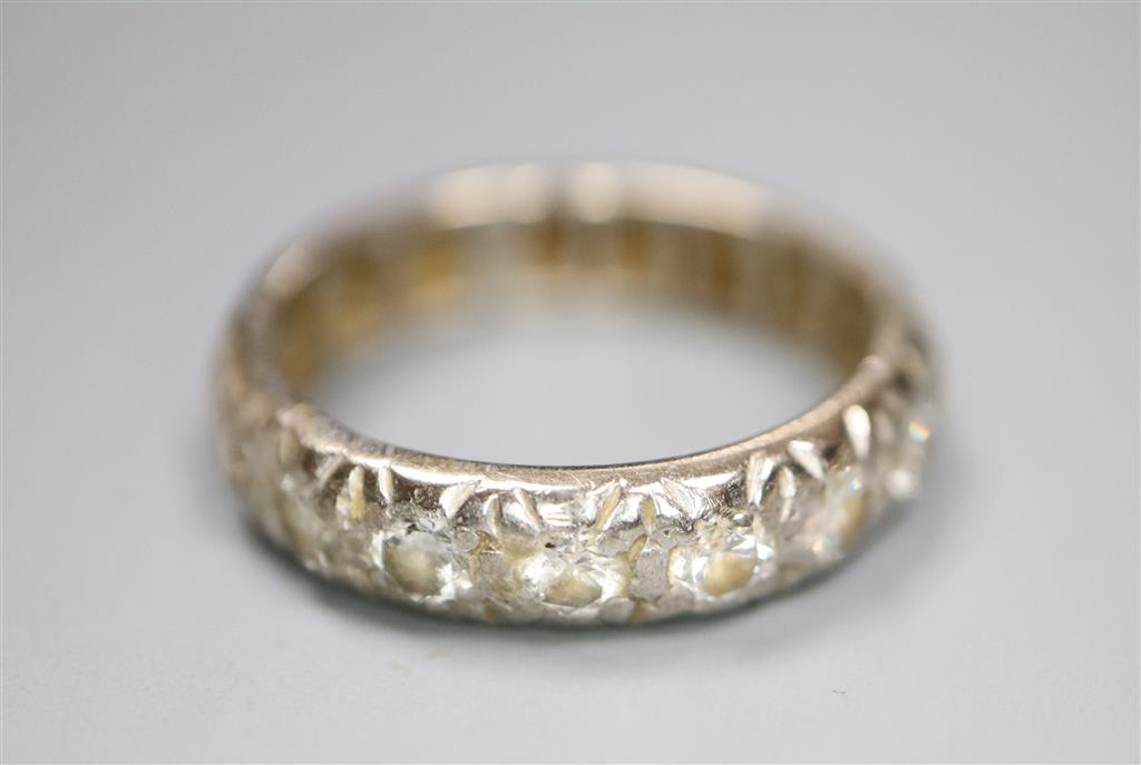 An 18ct white metal and diamond set full eternity ring, size N/O, gross 5.1 grams.